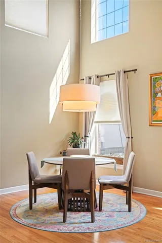a view of a dining room with furniture window and wooden floor