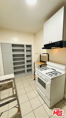 a view of living room with furniture and a fireplace