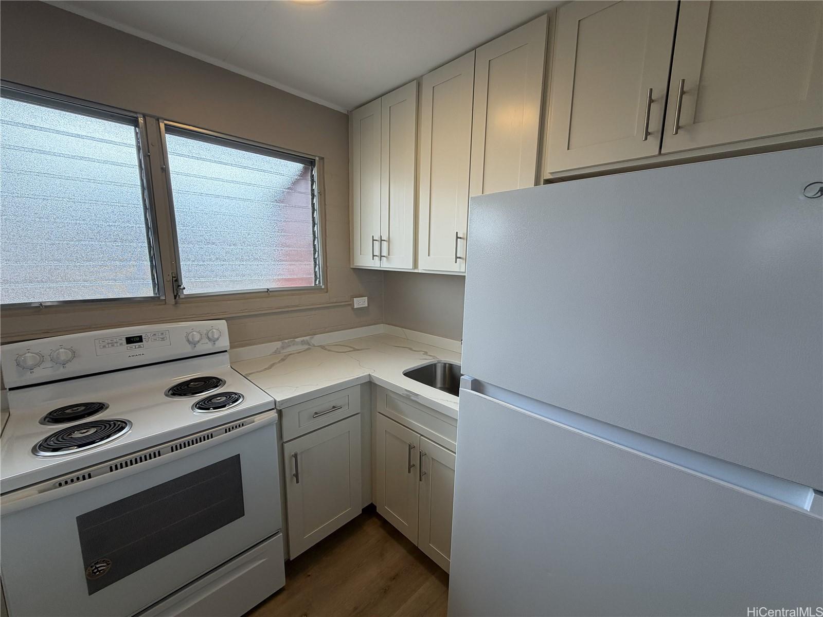 733 Coolidge Street, Unit 207 Honolulu, HI 96826 - Photo 3 of 6 a view of a kitchen with sink and dishwasher