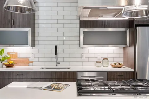 a kitchen with a stove and a microwave