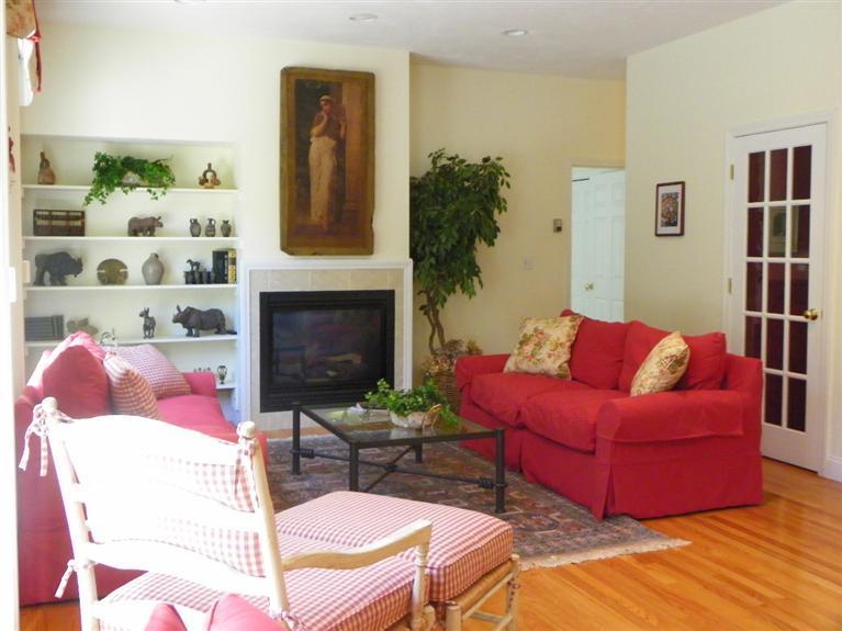 8 Finway Mashpee, MA 02649 - Photo 11 of 35 a living room with furniture fireplace and rug