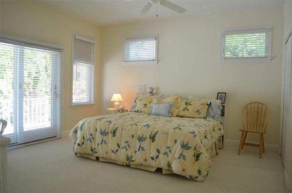 8 Finway Mashpee, MA 02649 - Photo 14 of 35 a bed sitting in a bedroom next to a window