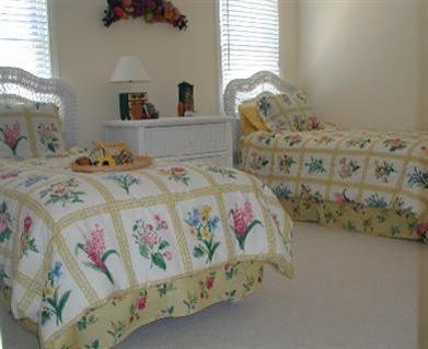 8 Finway Mashpee, MA 02649 - Photo 22 of 35 a bedroom with a bed next to a window and a dresser