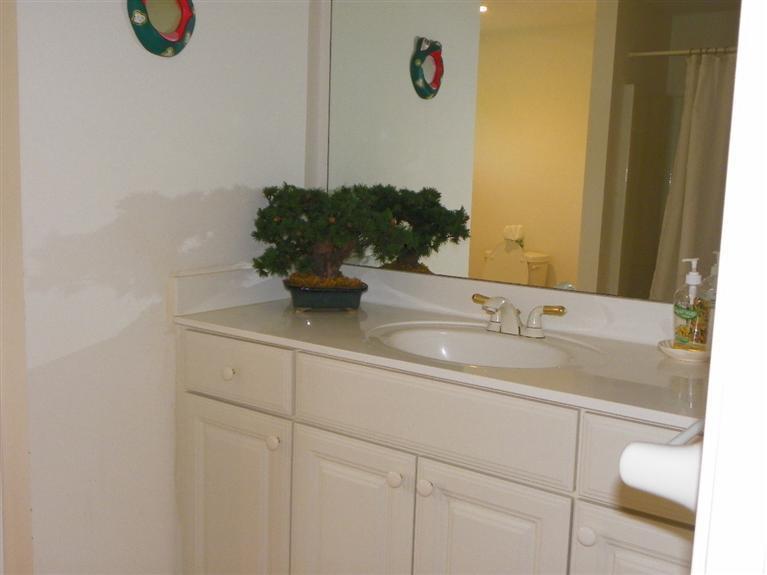 8 Finway Mashpee, MA 02649 - Photo 26 of 35 a bathroom with a sink and a mirror