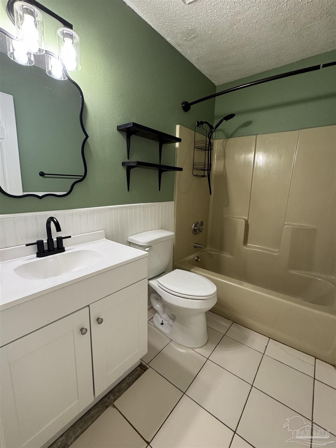 4400 Mundy Lane Pace, FL 32571 - Photo 13 of 23 a bathroom with a toilet sink and mirror