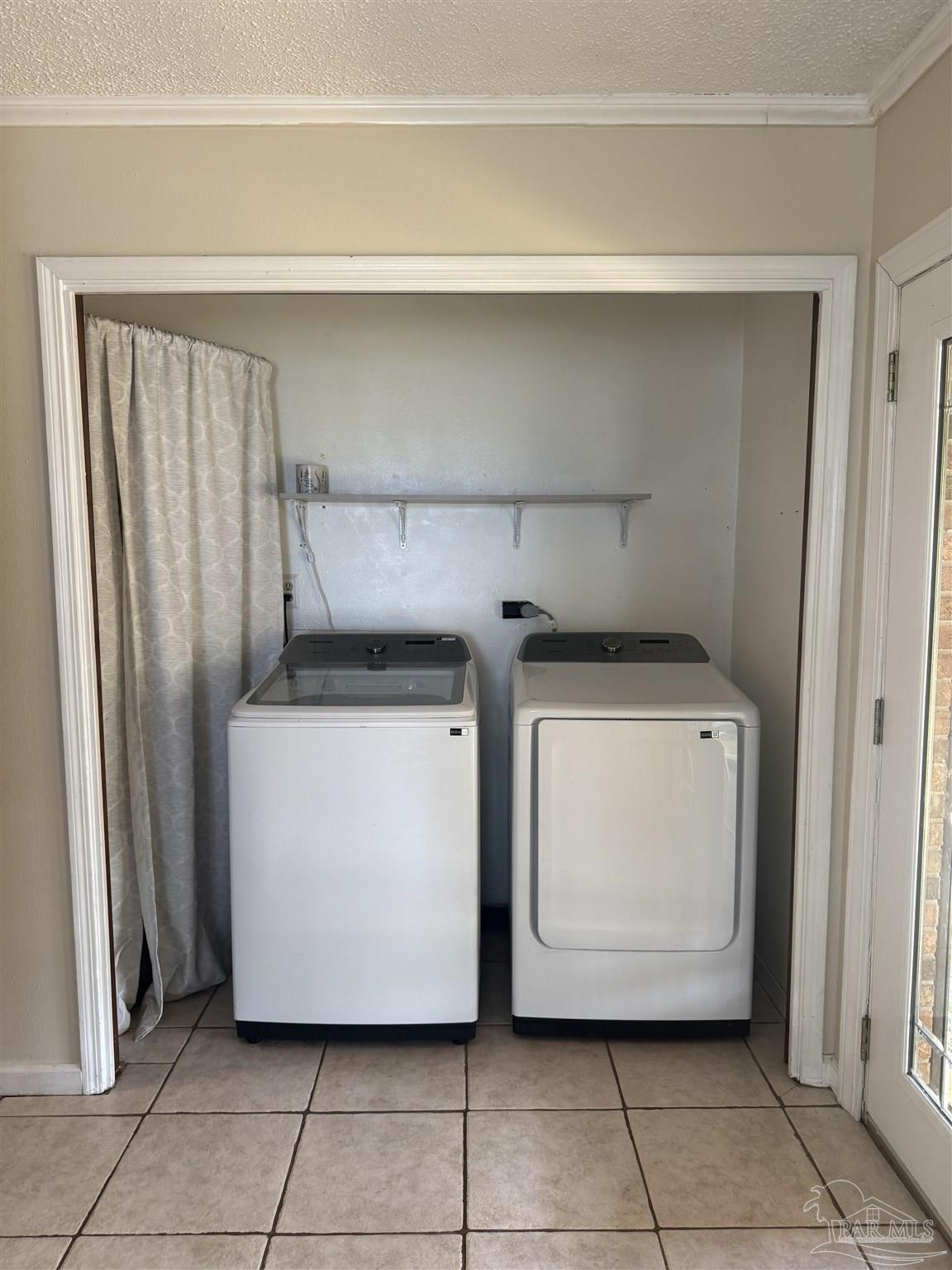 4400 Mundy Lane Pace, FL 32571 - Photo 17 of 23 a utility room with a washer and dryer