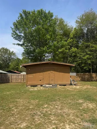 a view of swimming pool with a yard