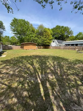 a view of a swimming pool with an outdoor space and seating area