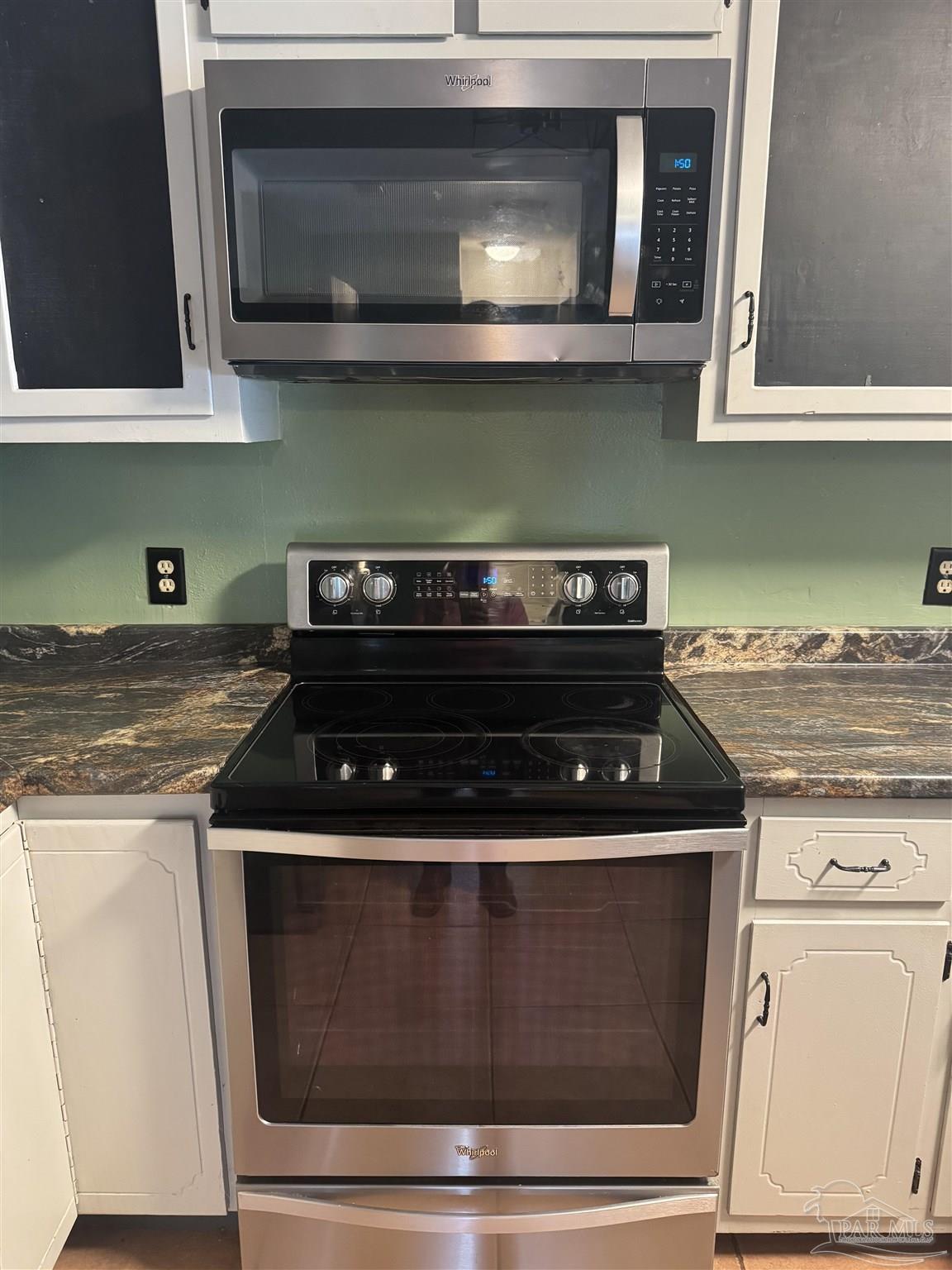 4400 Mundy Lane Pace, FL 32571 - Photo 3 of 23 a stove top oven sitting inside of a kitchen