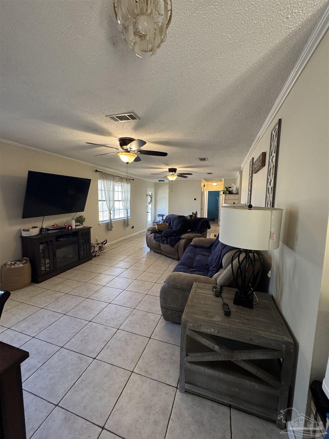 4400 Mundy Lane Pace, FL 32571 - Photo 5 of 23 a living room with furniture and a flat screen tv