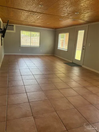 a view of an empty room with windows