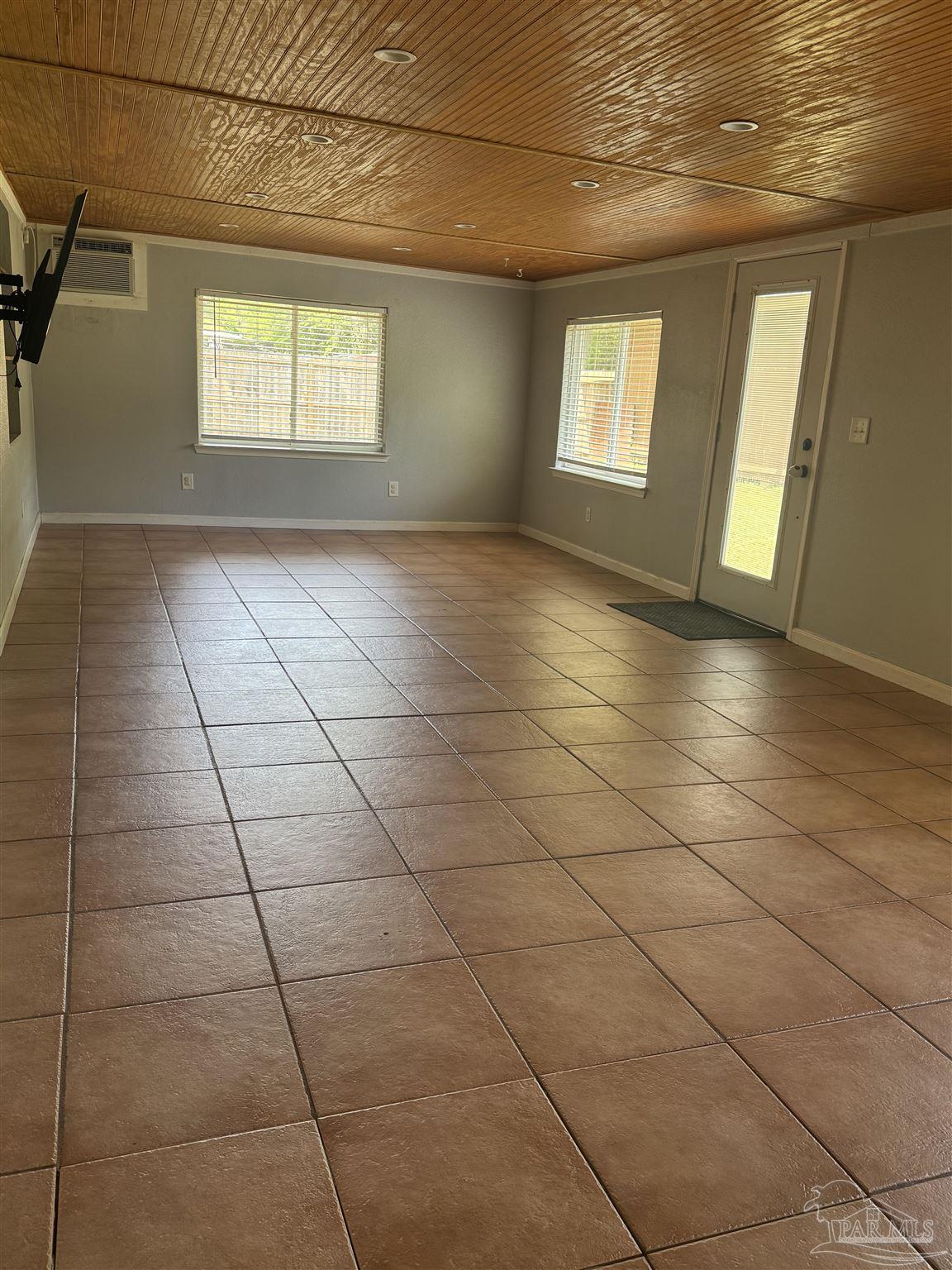 4400 Mundy Lane Pace, FL 32571 - Photo 9 of 23 a view of an empty room with windows
