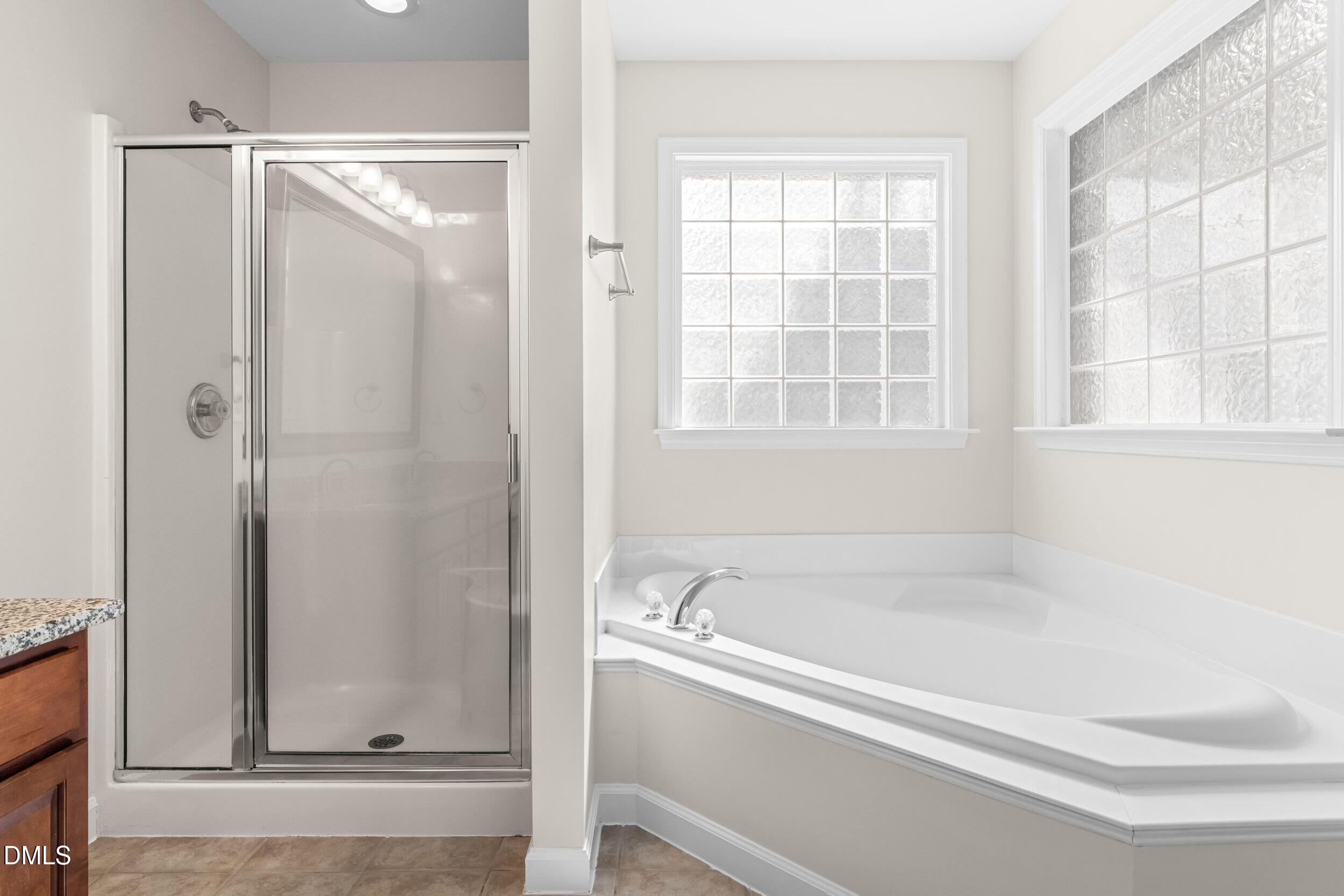 5708 Catskill Court Durham, NC 27713 - Photo 29 of 39 a bathroom with a bathtub and shower