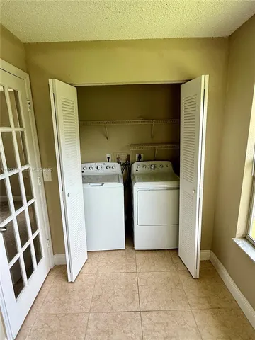 an empty room with a empty space and a window