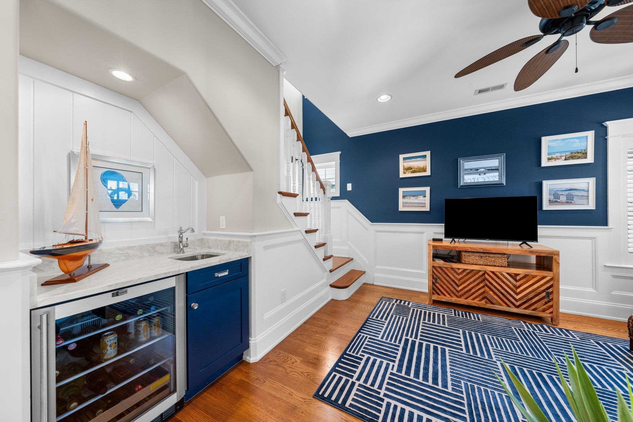 243 110th Street Stone Harbor, NJ 08247 - Photo 13 of 34 a living room with stainless steel appliances furniture a flat screen tv and kitchen view