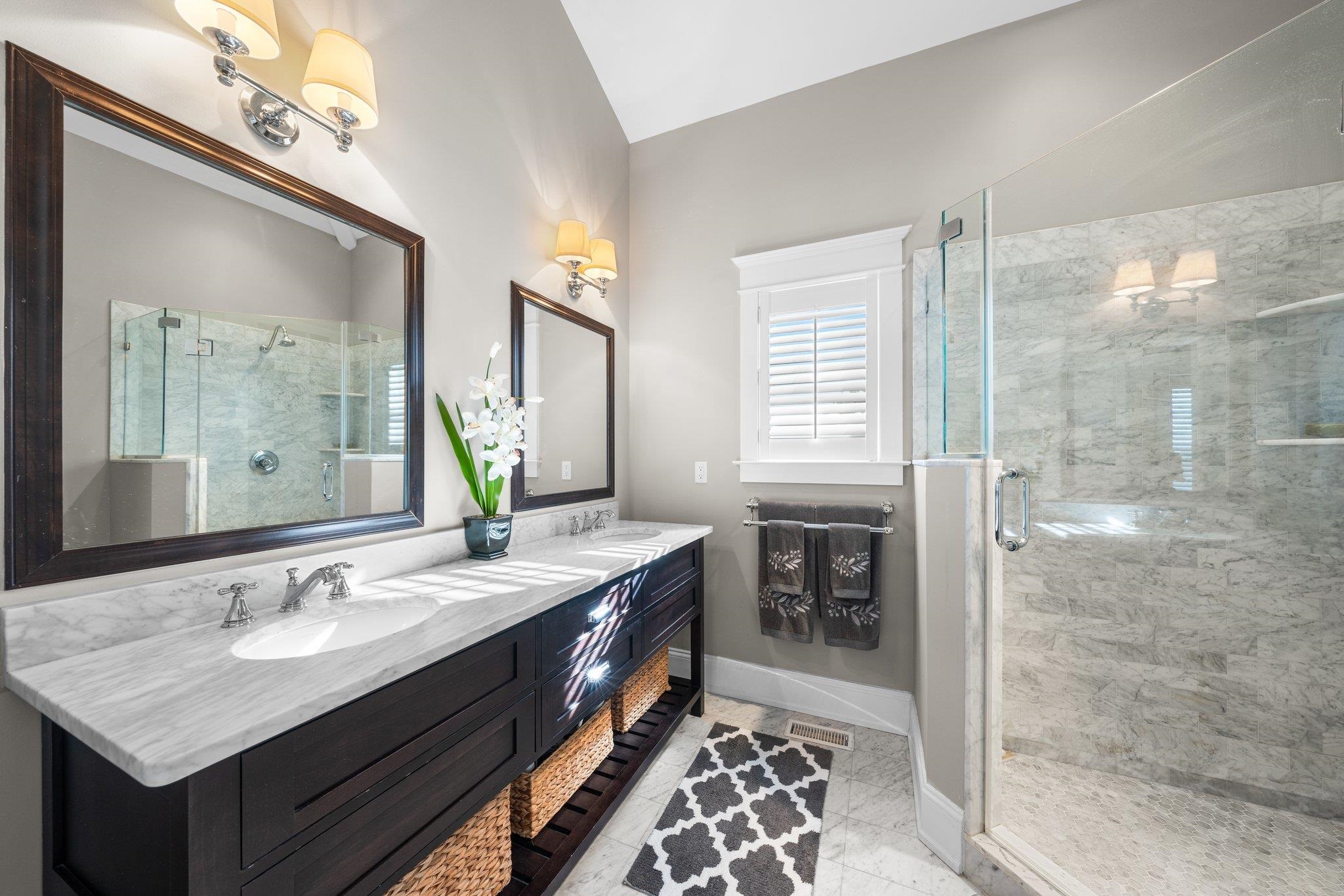 243 110th Street Stone Harbor, NJ 08247 - Photo 19 of 34 a bathroom with a sink double vanity and a shower
