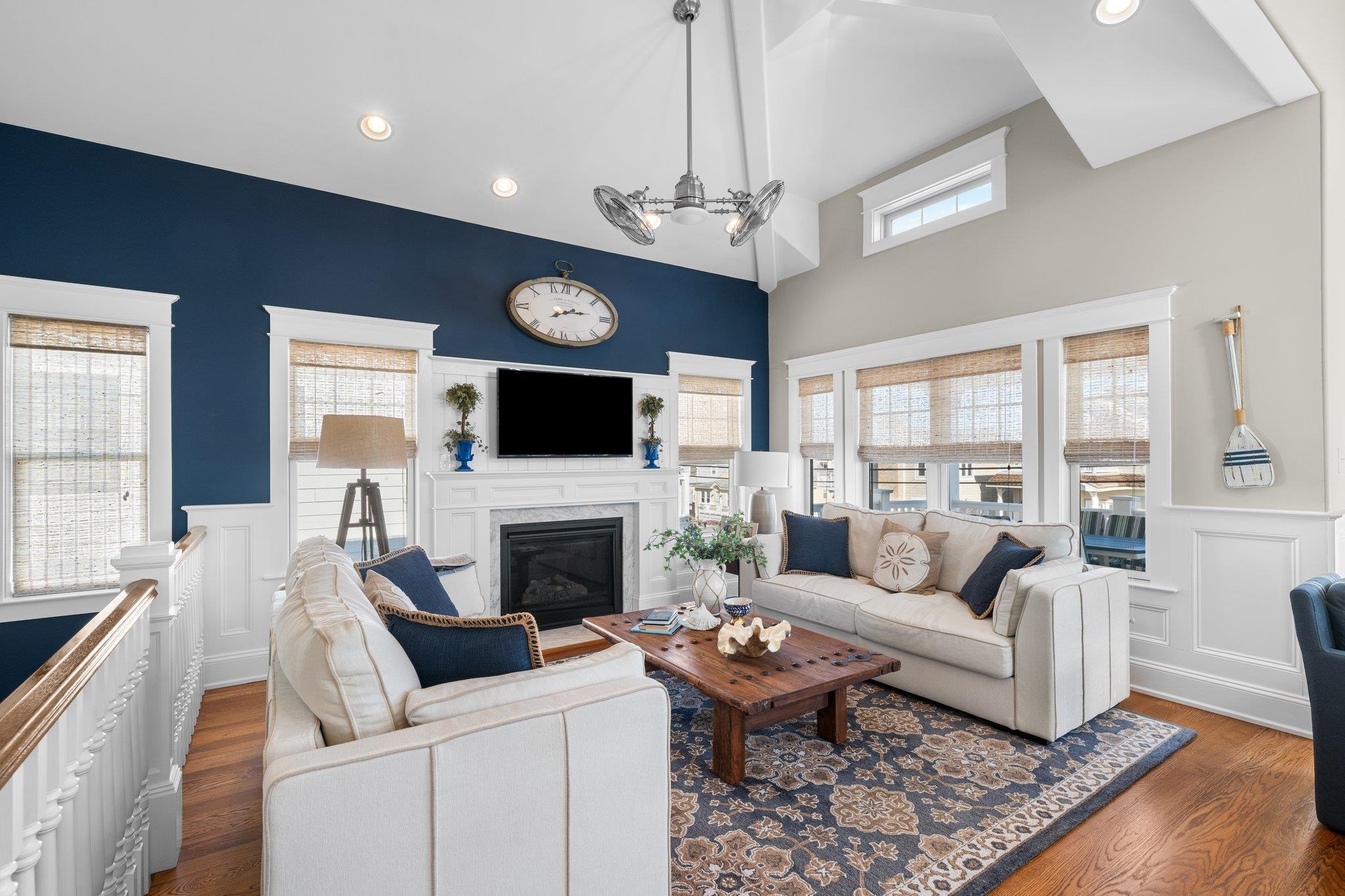243 110th Street Stone Harbor, NJ 08247 - Photo 22 of 34 a living room with fireplace furniture and a flat screen tv