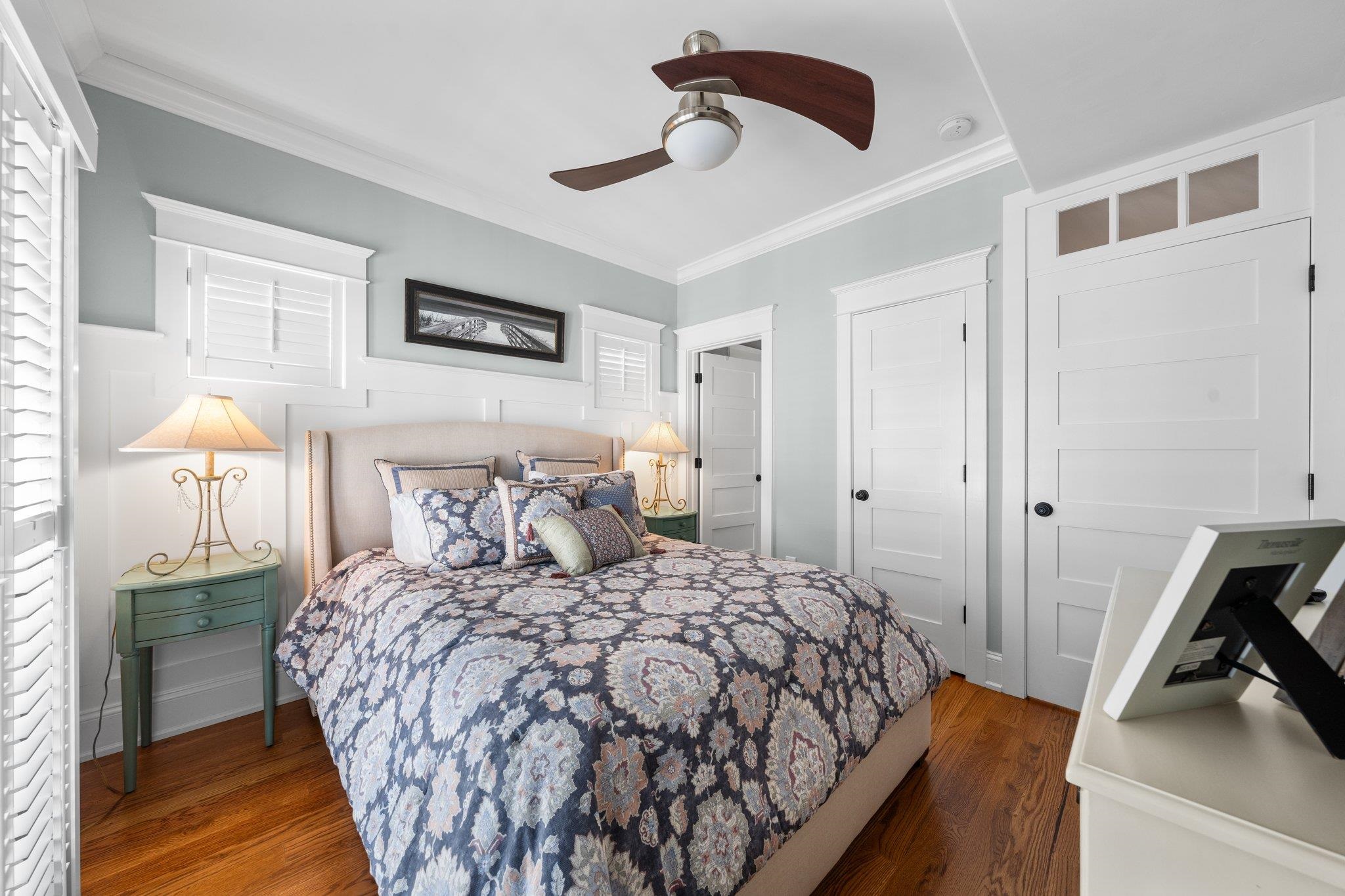243 110th Street Stone Harbor, NJ 08247 - Photo 4 of 34 a bedroom with a bed and a lamp on the dresser