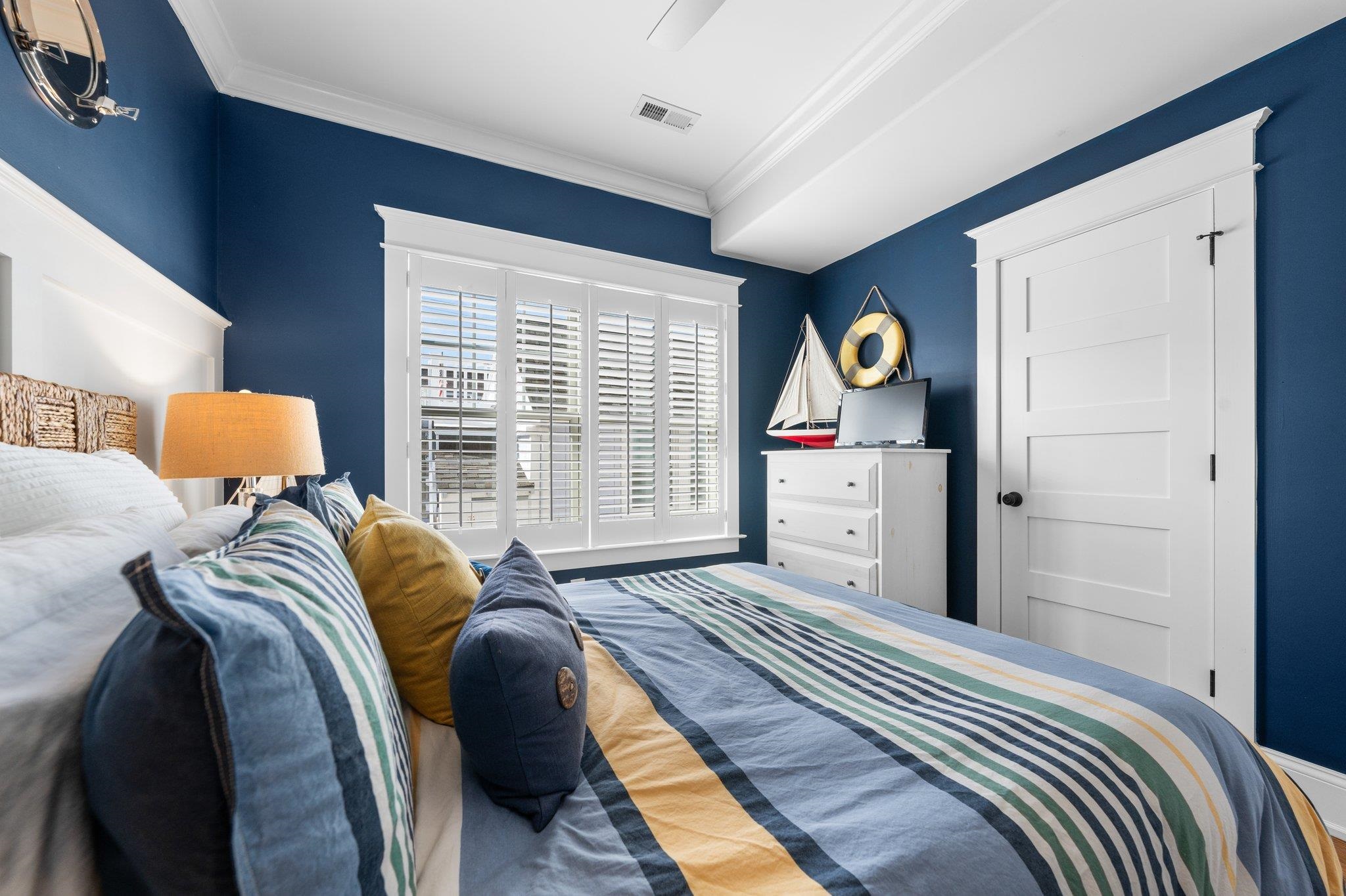 243 110th Street Stone Harbor, NJ 08247 - Photo 9 of 34 a bedroom with a bed and window