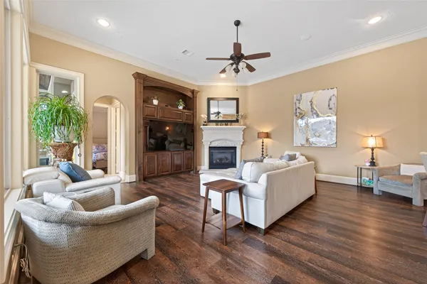 a living room with furniture fireplace and a flat screen tv