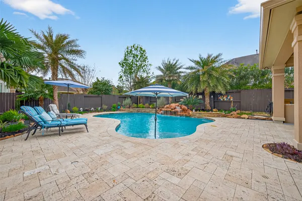 a view of swimming pool from a lake view