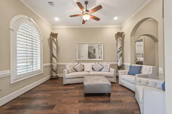 a room with wooden floor and furniture
