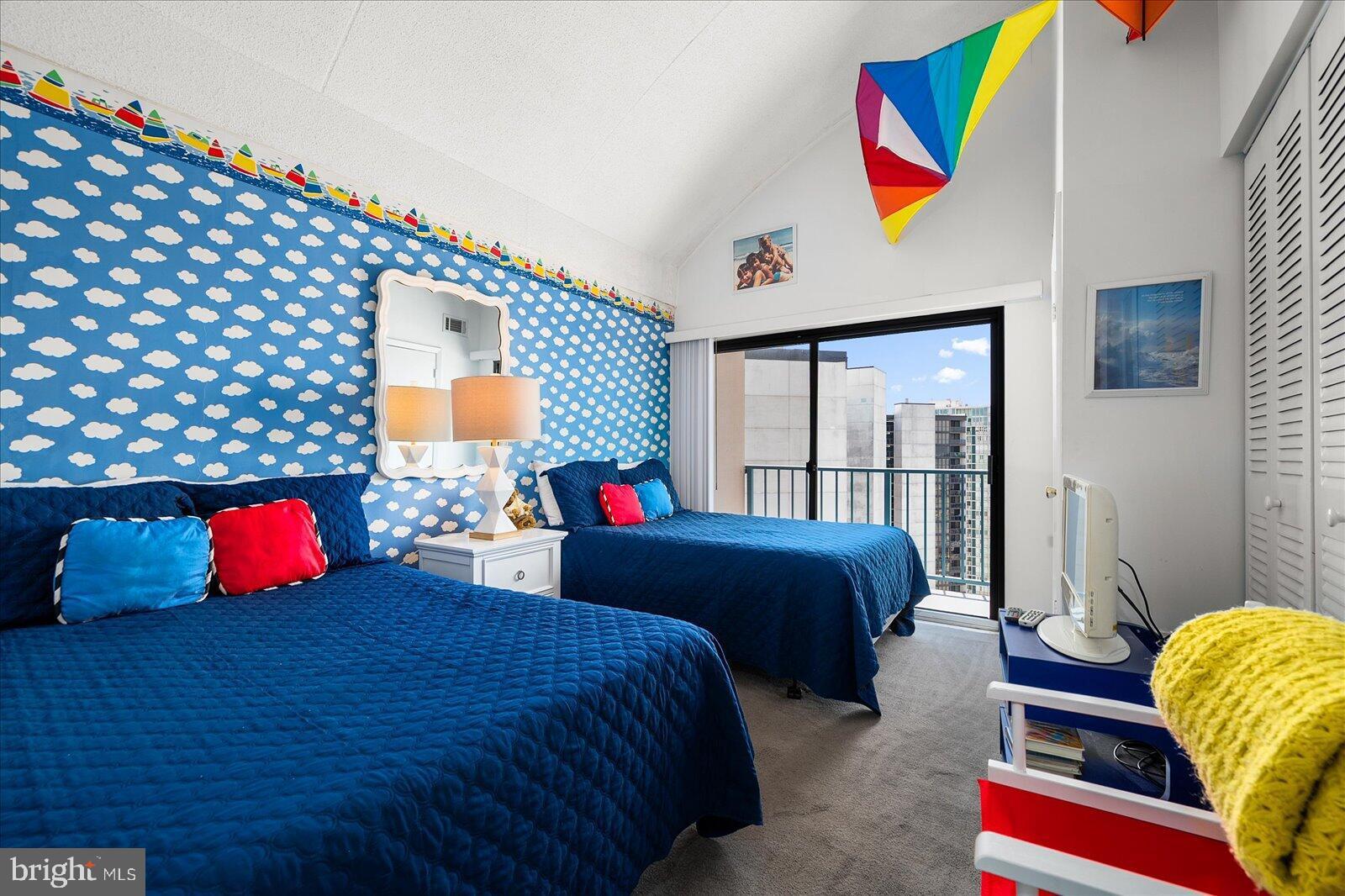 11000 Coastal Highway, Unit 2005 Ocean City, MD 21842 - Photo 17 of 47 Vibrant bedroom with playful cloud decor.