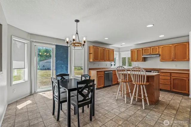 a view of a dining room with furniture window and outside view