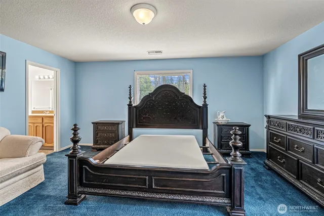 a living room with couch and a chandelier