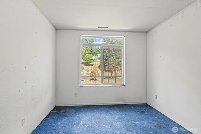 a room with furniture and a large window