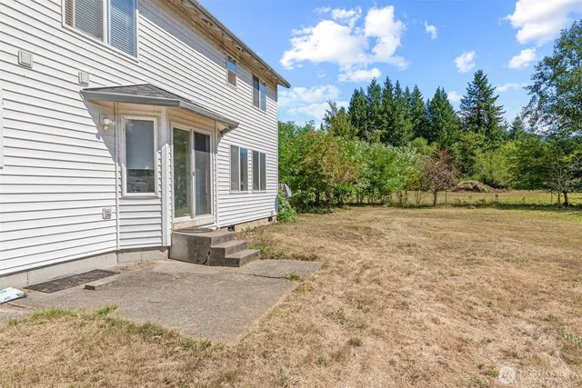 a house with trees in the background
