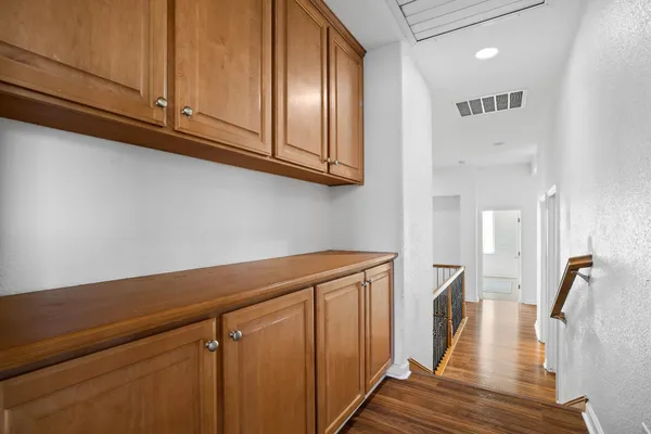 a view of a kitchen with wooden floor