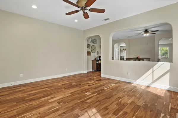 a view of a livingroom with a furniture window and wooden floor