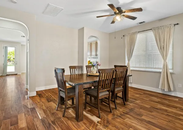 a view of a dining room with furniture window and wooden floor