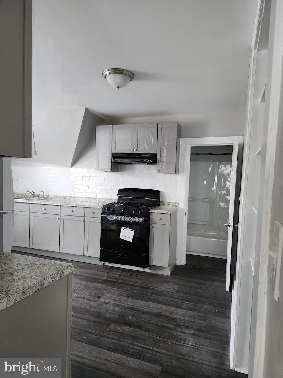 108 New Broadway, Unit 100B Brooklawn, NJ 08030 - Photo 6 of 14 a kitchen with stainless steel appliances granite countertop a stove and a refrigerator