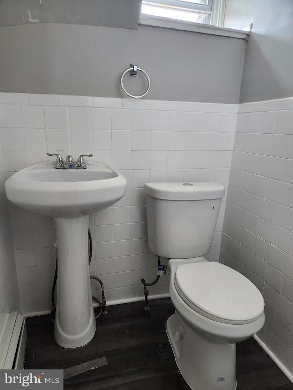108 New Broadway, Unit 100B Brooklawn, NJ 08030 - Photo 8 of 14 a bathroom with a toilet a sink and mirror