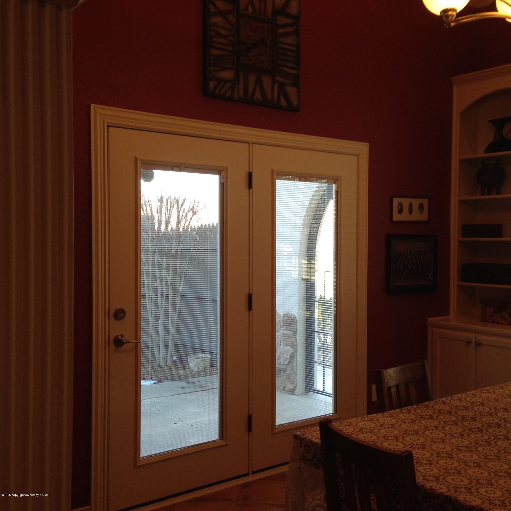6006 Riley Elizabeth Drive Amarillo, TX 79119 - Photo 13 of 42 doors from dining room to side patio
