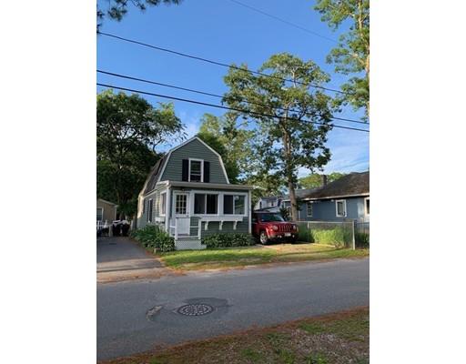 13 Butler Street Wareham, MA 02532 - Photo 4 of 29 a front view of a house with a yard garage and outdoor seating