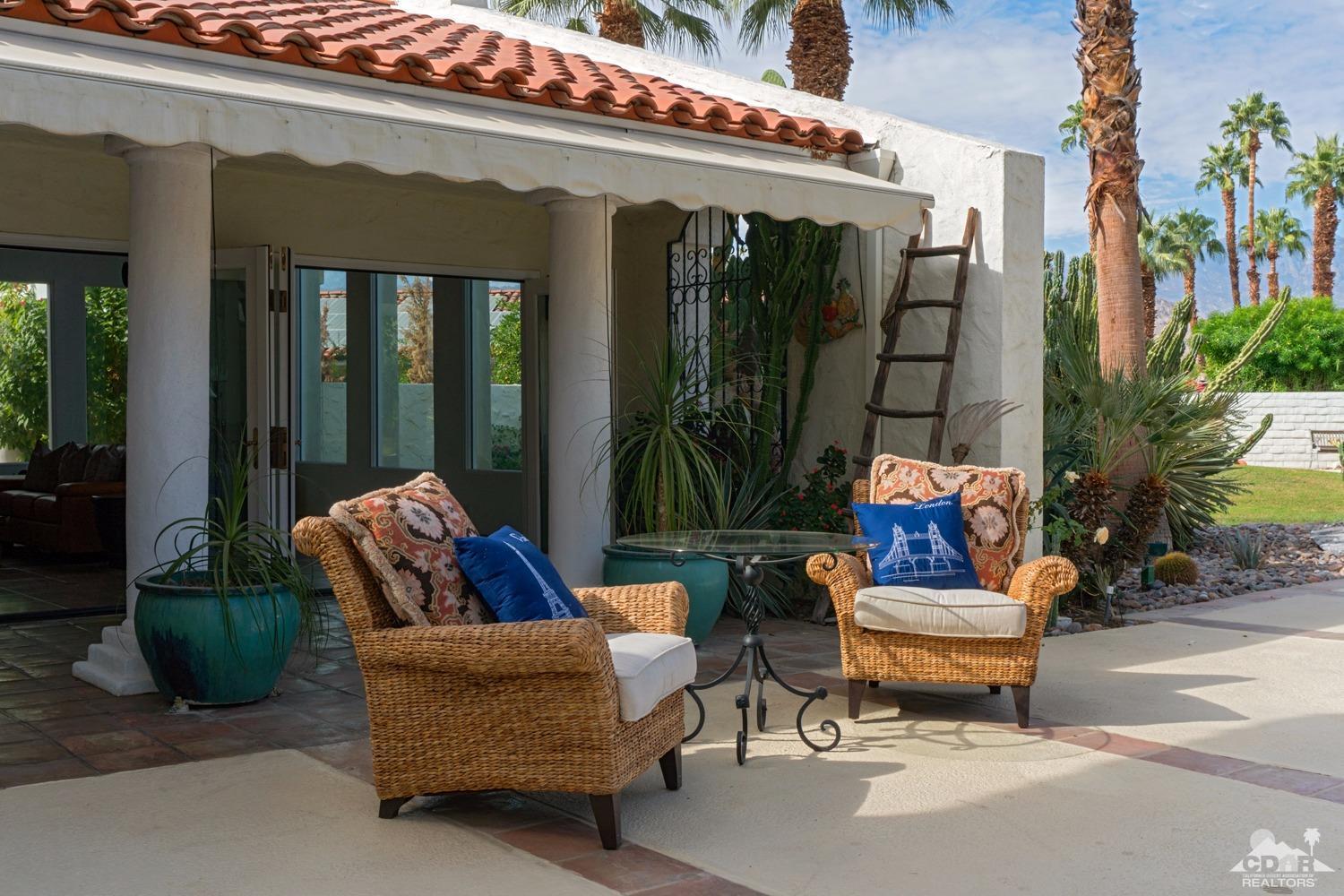 2 Vista Santa Rosa Rancho Mirage, CA 92270 - Photo 13 of 60 a outdoor living space with furniture and a potted plant