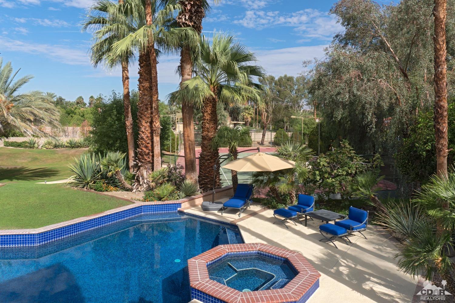2 Vista Santa Rosa Rancho Mirage, CA 92270 - Photo 14 of 60 a view of a backyard with a patio and swimming pool