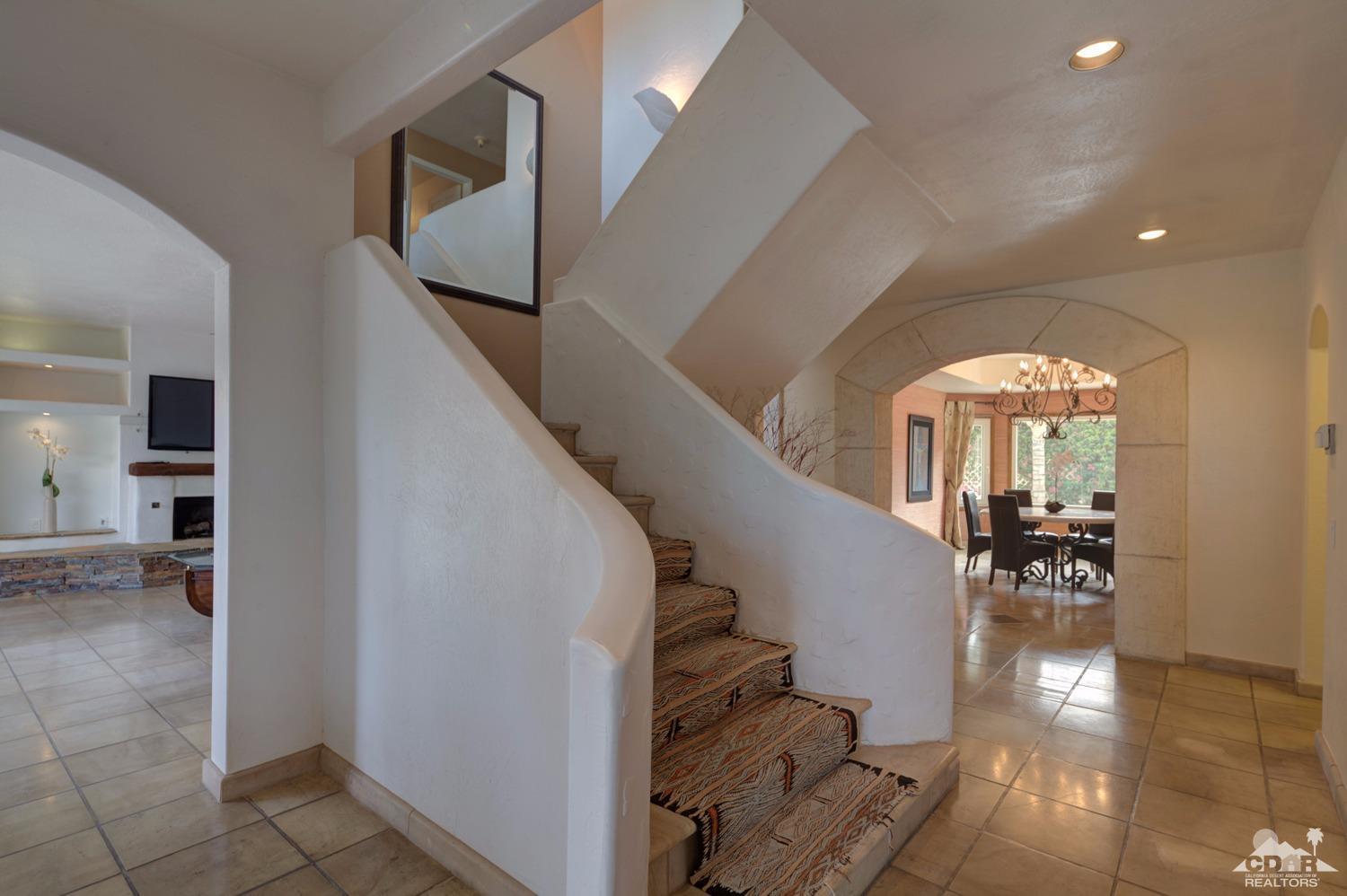 2 Vista Santa Rosa Rancho Mirage, CA 92270 - Photo 22 of 60 a view of entryway and hall with wooden floor