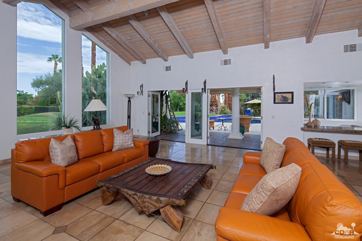 2 Vista Santa Rosa Rancho Mirage, CA 92270 - Photo 25 of 60 a living room with furniture and a open kitchen view