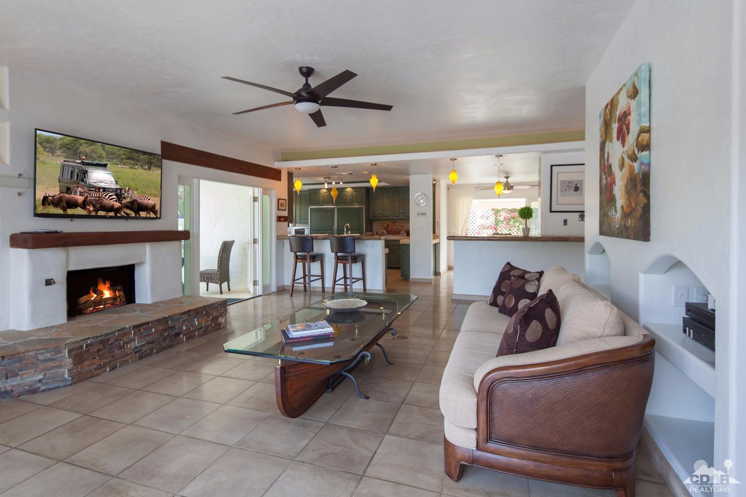 2 Vista Santa Rosa Rancho Mirage, CA 92270 - Photo 27 of 60 a living room with furniture and a fireplace