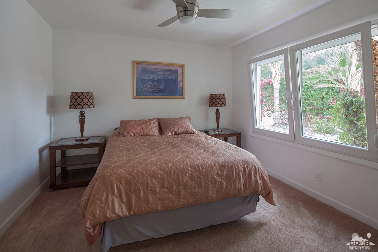 2 Vista Santa Rosa Rancho Mirage, CA 92270 - Photo 40 of 60 a bedroom with a bed and window