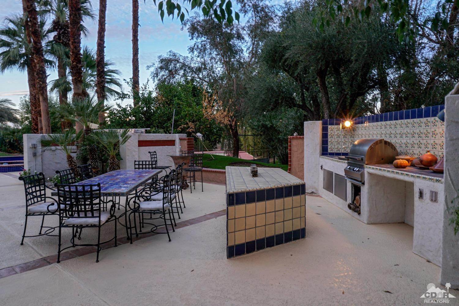 2 Vista Santa Rosa Rancho Mirage, CA 92270 - Photo 47 of 60 a view of a patio with dining table and chairs