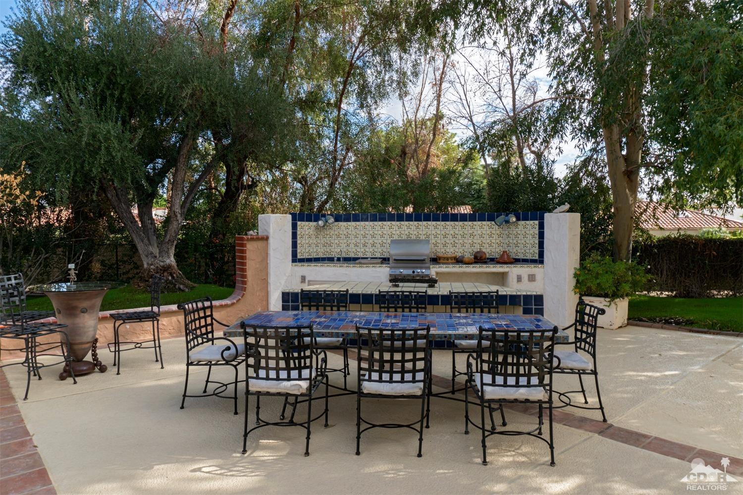 2 Vista Santa Rosa Rancho Mirage, CA 92270 - Photo 48 of 60 a view of a chairs and table in backyard