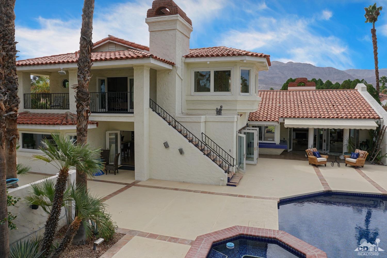 2 Vista Santa Rosa Rancho Mirage, CA 92270 - Photo 54 of 60 a front view of a house with porch