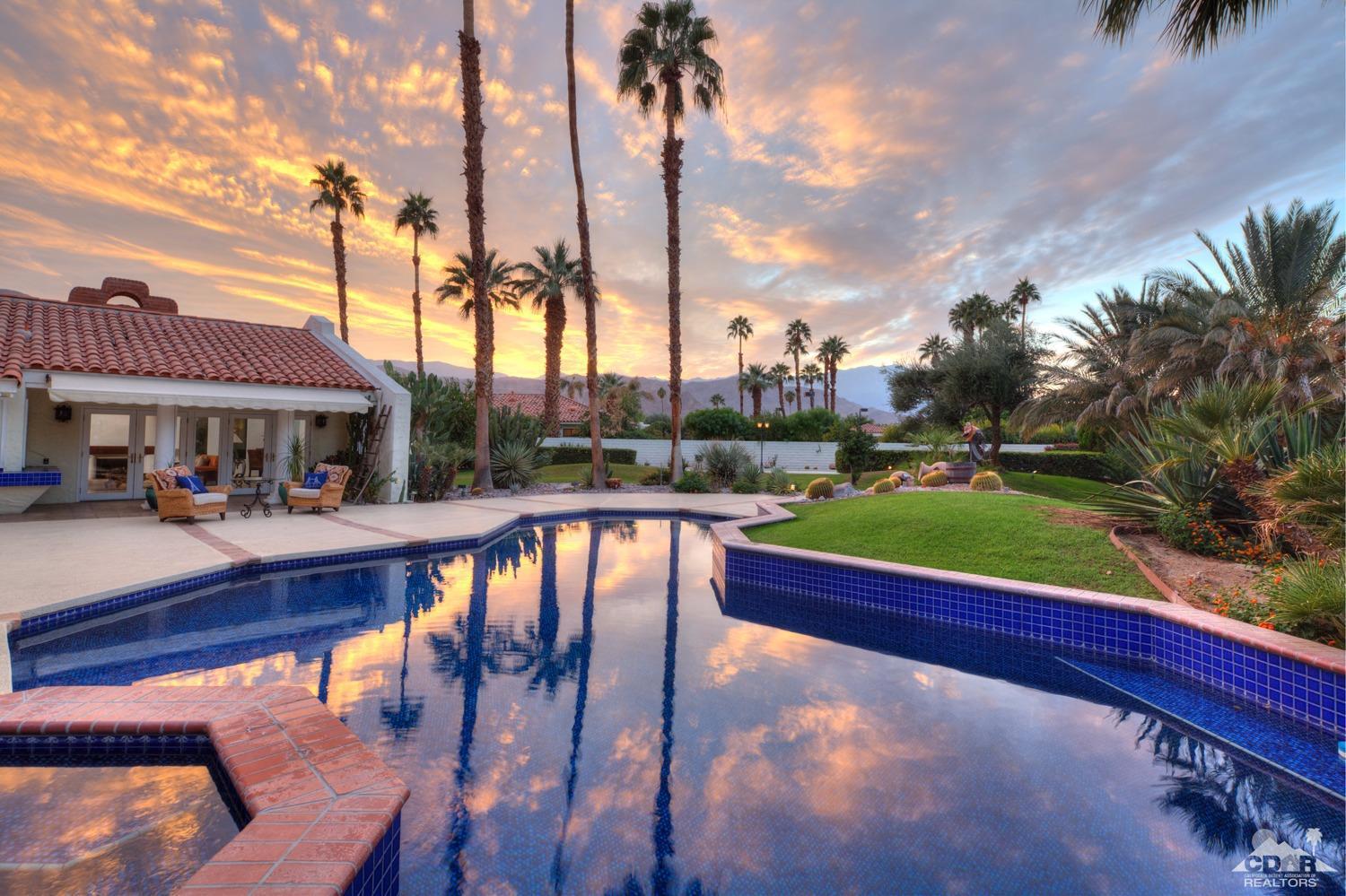 2 Vista Santa Rosa Rancho Mirage, CA 92270 - Photo 9 of 60 a view of swimming pool with lawn chairs and a yard
