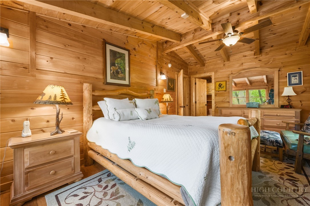 259 Greenbriar Road Beech Mountain, NC 28604 - Photo 21 of 41 a bed room with a bed and a dresser