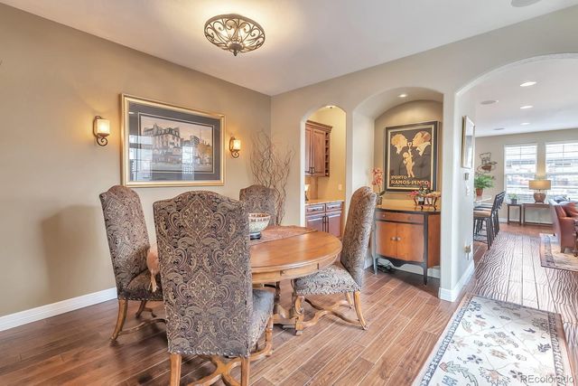 a view of a dining room with furniture wooden floor and a rug